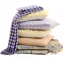 Как лучше хранить одеяла и подушки